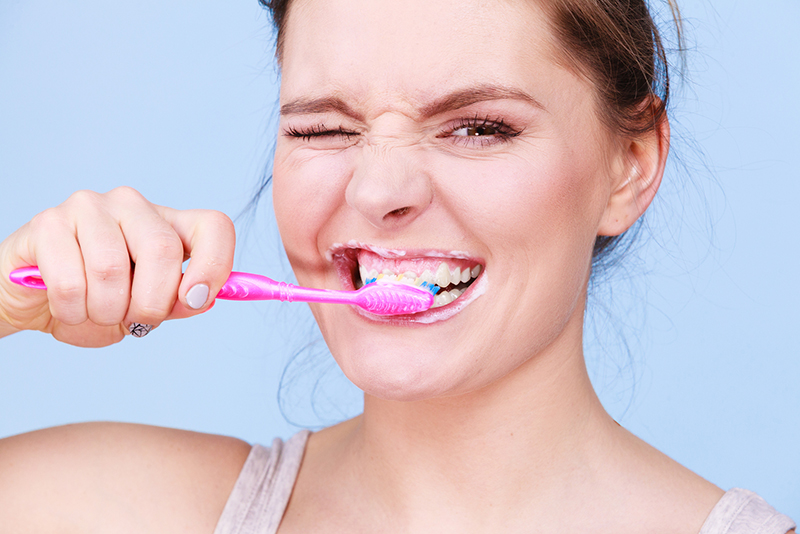 Woman Brushing Her Teeth